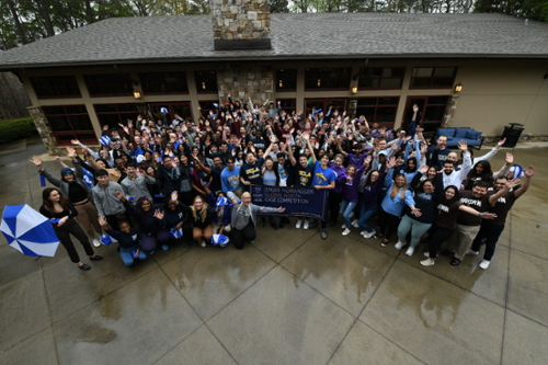 People holding a giant donation check